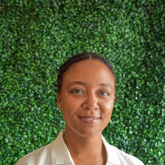 Stephanie smiling in a clean white shirt.