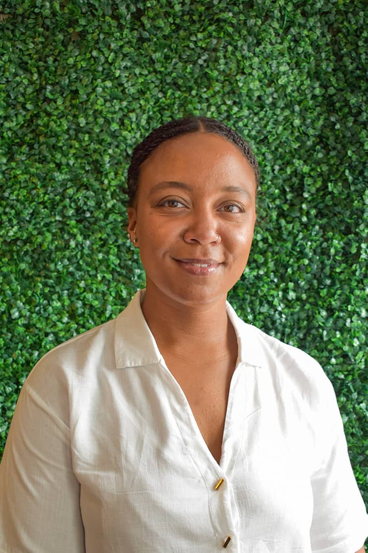 Stephanie smiling in a clean white shirt.